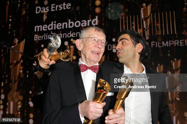 Hark Bohm Fatih Akin pose with their awards after the Lola - German Film Award show at Messe Berlin on April 27, 2018 in Berlin, Germany.