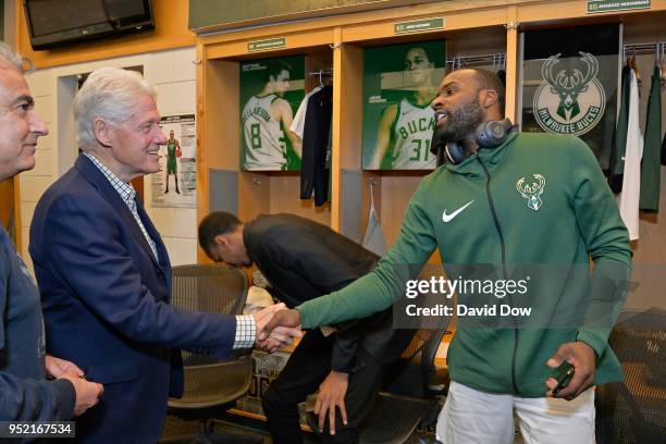 Milwaukee, WI Former President of the United States of America Bill Clinton shakes hands with Shabazz Muhammad of the Milwaukee Bucks in Game Six of...