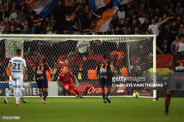 Saint-Etienne's French goalkeeper Stéphane Ruffier stops a penalty during the French L1 football match between Montpellier and Saint Etienne, on...
