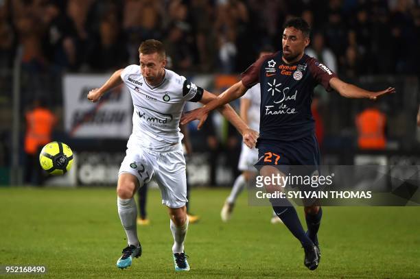 Saint-Etienne's Slovenian forward Robert Beric vies with Montpellier's Uruguayan midfielder Facundo Piriz during the French L1 football match between...