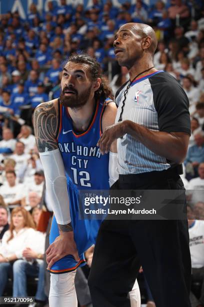 Steven Adams of the Oklahoma City Thunder and Referee Tom Washington look on during Game Five of Round One of the 2018 NBA Playoffs against the Utah...