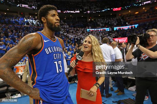 Paul George of the Oklahoma City Thunder talks with Lesley McCaslin after Game Five of Round One of the 2018 NBA Playoffs against the Utah Jazz on...