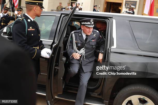 Military officers arrive with Polish Defense Minister Mariusz Blaszczak for an Enhanced Honor Cordon at the Pentagon River Entrance April 27, 2018 in...
