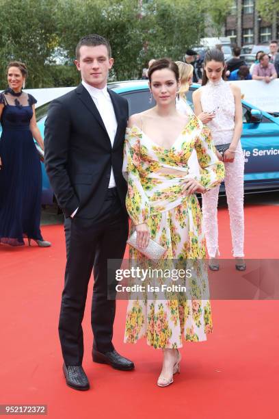 German actors Jannis Niewoehner and Emilia Schuele attend the Lola - German Film Award red carpet at Messe Berlin on April 27, 2018 in Berlin,...