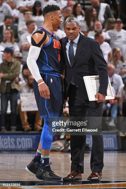 Russell Westbrook of the Oklahoma City Thunder and Assistant Coach Maurice Cheeks of Oklahoma City Thunder look on during Game Four of Round One of...