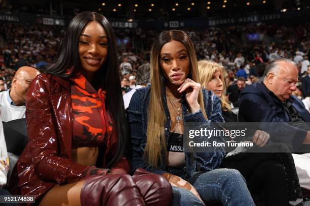 Winnie Harlow enjoys the game between the Washington Wizards and the Toronto Raptors in Game Five of the Eastern Conference Quarterfinals during the...