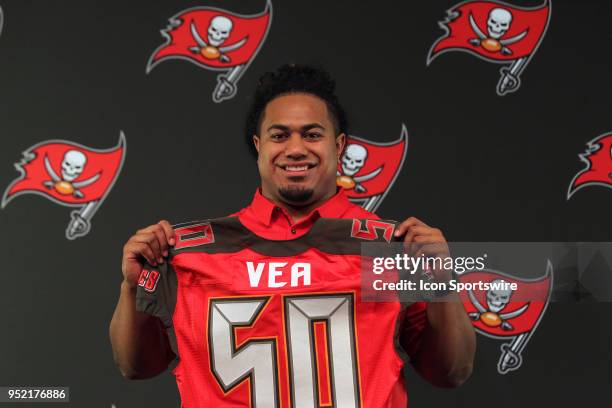 Tampa Bay Buccaneers first round pick out of University of Washington Vita Vea holds up his jersey for the gathered media on April 27, 2018 at One...