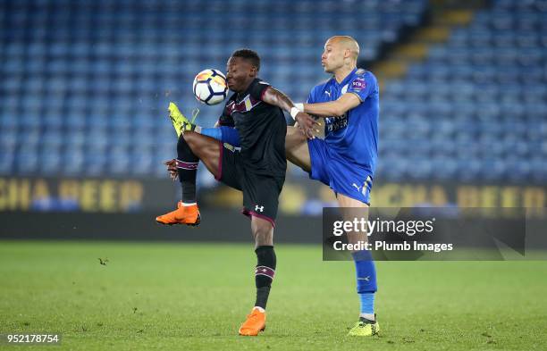 Yohan Benalouane of Leicester City in action with Rushian Hepburn-Murphy of Aston Villa during the Premier League Cup Semi Final tie between...