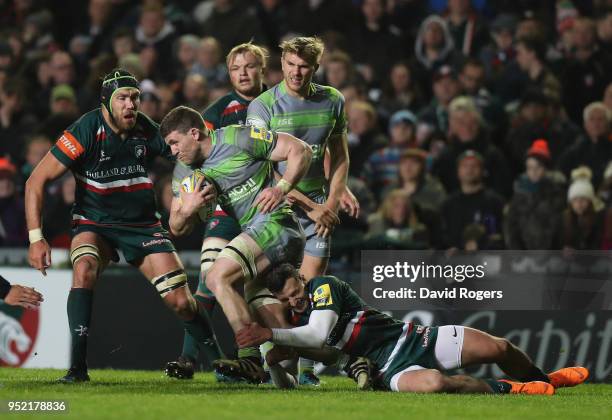 Mark Wilson of Newcastle Falcons is tackled by Jonny May of Leicester Tigers during the Aviva Premiership match between Leicester Tigers and...