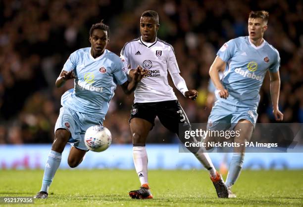 Fulham's Ryan Sessegnon battles for the ball with Sunderland's Joel Asoro and Paddy McNair during the Sky Bet Championship match at Craven Cottage,...