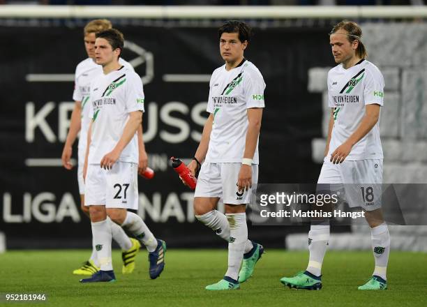 Pirmin Schwegler, Timo Huebers, Miiko Albornoz and Iver Fossum of Hannover show their disappointment after the Bundesliga match between TSG 1899...