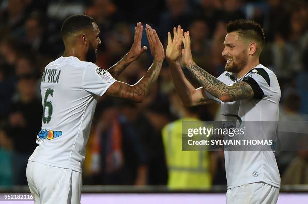 Saint-Etienne's French midfielder Yann M'vila and Saint-Etienne's French defender Mathieu Debuchy react at the end of the French L1 football match...