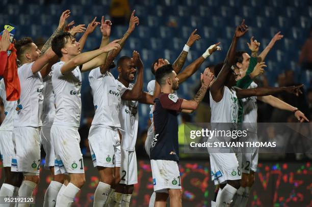 Saint-Etienne's players react at the end of the French L1 football match between Montpellier and Saint Etienne, on April 27, 2018 at the La Mosson...