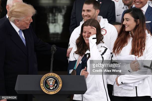 President Donald Trump greets snowboarder Arielle Gold as he hosts Team USA at the North Portico of the White House April 27, 2018 in Washington, DC....