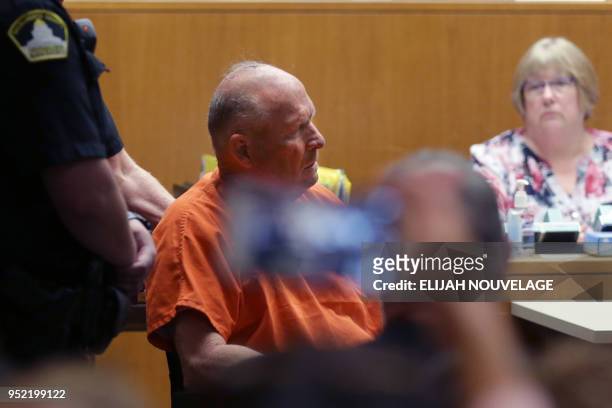 Joseph James DeAngelo is taken on a wheel chair into the courtroom to be arraigned on two counts of murder April 27 in Sacramento, California. -...