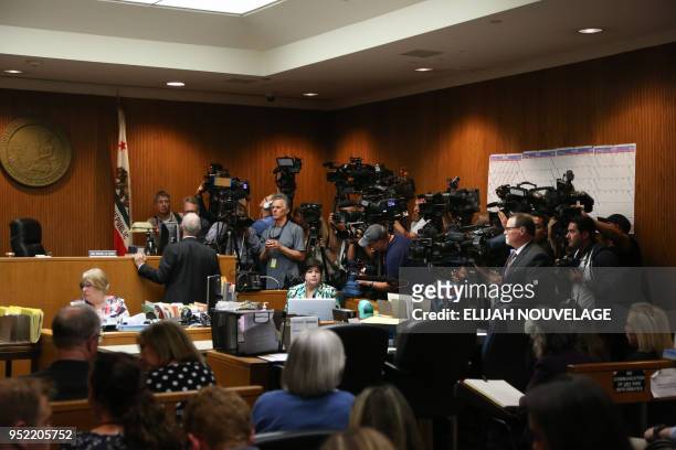 Members of the media await the arrival of Joseph James DeAngelo for his arraignment on two charges of murder April 27, 2018 in Sacramento,...