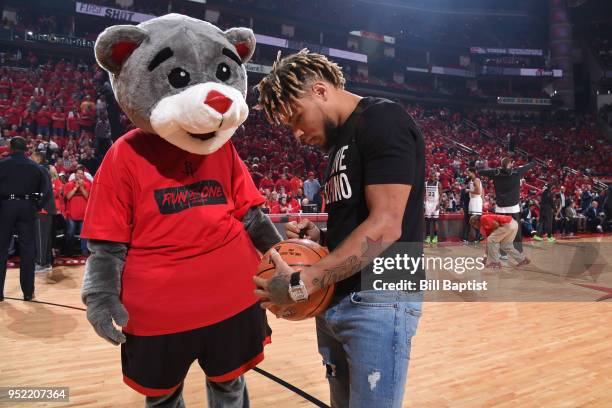 Tyrann Mathieu signs an autograph during Game Five of the Western Conference Quarterfinals during the 2018 NBA Playoffs between the Minnesota...