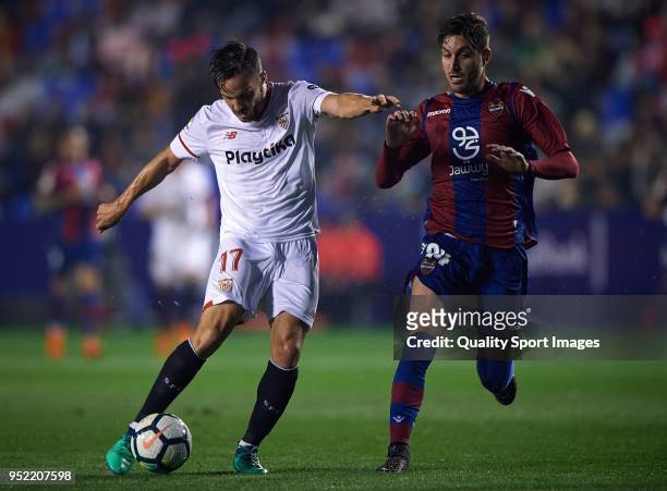 Jose Gomez Campana of Levante competes for the ball with Pablo Sarabia of Sevilla during the La Liga match between Levante and Sevilla at Ciutat de...