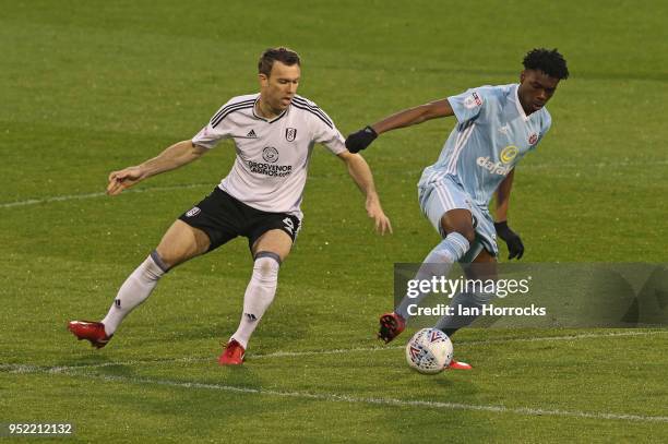 Ovie Ejaria of Sunderland is challenged by Kevin McDonald during the Sky Bet Championship match between Fulham and Sunderland at Craven Cottage on...