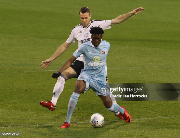 Ovie Ejaria of Sunderland is challenged by Kevin McDonald during the Sky Bet Championship match between Fulham and Sunderland at Craven Cottage on...