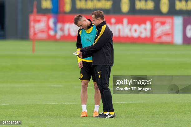 Andrey Yarmolenko of Dortmund and Assistant coach Joerg Heinrich of Dortmund look on during a training session at BVB trainings center on April 24,...