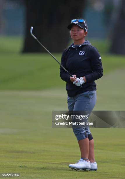 Megan Kang watches her third shot on the 10th hole during the second round of the Mediheal Championship at Lake Merced Golf Club on April 27, 2018 in...