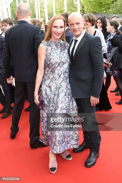 German actors Andrea Sawatzki and Christian Berkel attend the Lola - German Film Award red carpet at Messe Berlin on April 27, 2018 in Berlin,...