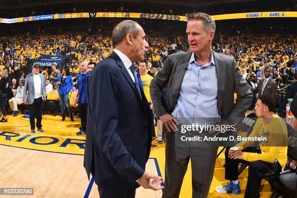 Assistant Coach Ettore Messina of the San Antonio Spurs speaks with Head Coach Steve Kerr of the Golden State Warriors during the game between the...