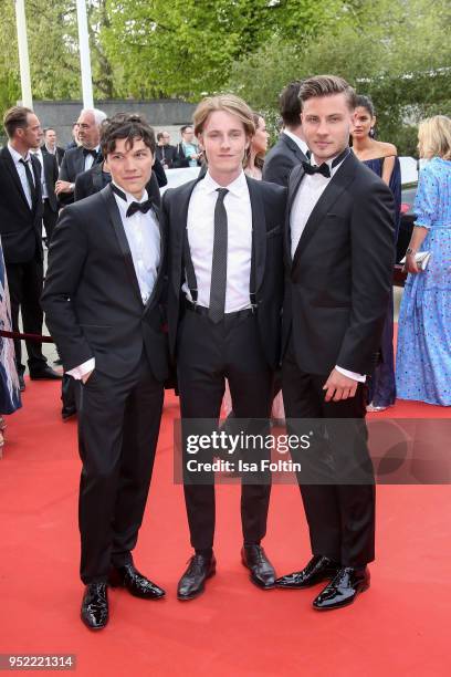 German actor Sebastian Urzendowsky, German actor Louis Hofmann and German actor Jannik Schuemann attend the Lola - German Film Award red carpet at...