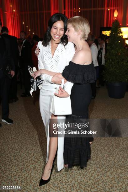 Gizem Emre, dress white, and Jella Haase barefoot during the Lola - German Film Award party at Palais am Funkturm on April 27, 2018 in Berlin,...