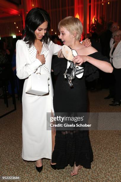 Gizem Emre, dress white, and Jella Haase barefoot during the Lola - German Film Award party at Palais am Funkturm on April 27, 2018 in Berlin,...