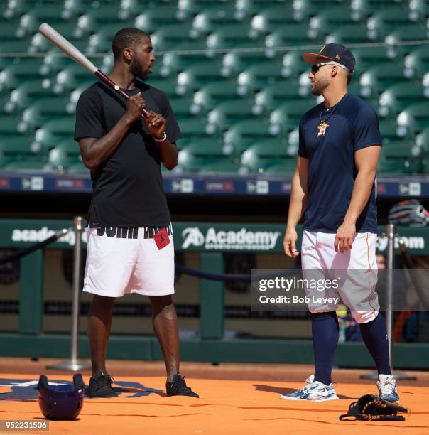 Michael Kidd-Gilchrist of the Charlotte Hornets takes batting practice with the Houston Astros and George Springer at Minute Maid Park on April 27,...
