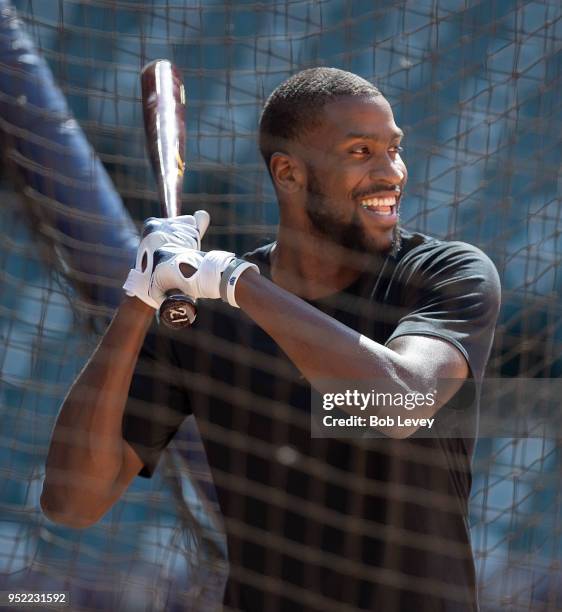 Michael Kidd-Gilchrist of the Charlotte Hornets takes batting practice with the Houston Astros and George Springer at Minute Maid Park on April 27,...