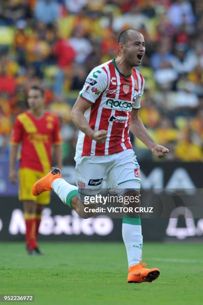 Carlos Gonzalez of Necaxa celebrates his goal against Morelia during their Mexican Clausura tournament football match at the Morelos stadium on April...