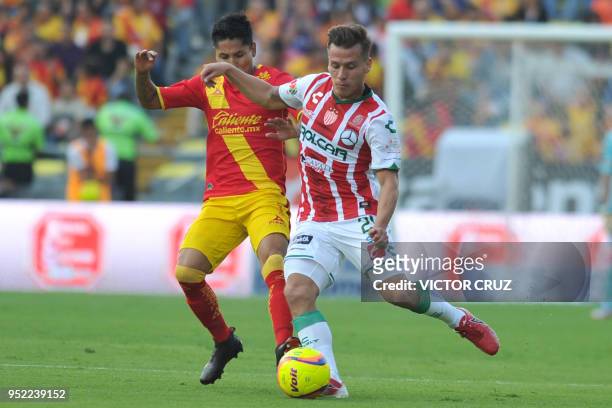 Raul Ruidiaz of Morelia vies for the ball with Fernando Gonzalez of Necaxa during their Mexican Clausura tournament football match at the Morelos...