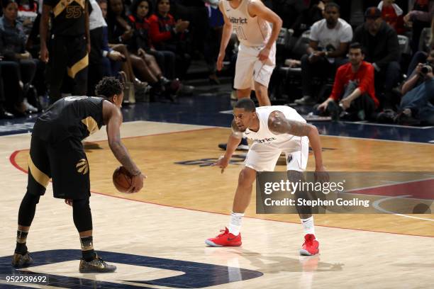 Bradley Beal of the Washington Wizards defends DeMar DeRozan of the Toronto Raptors in Game Six of the Eastern Conference Quarterfinals during the...