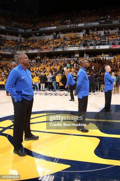 Referee officials Jason Phillips, Sean Wright, and Courtney Kirkland look on before the game between the Indiana Pacers and Cleveland Cavaliers in...