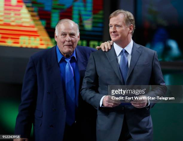 Hall of Famer and former Green Bay Packer Jerry Kramer, left, walks with NFL Commissioner Roger Goodell to announce the Packers' 45th overall pick,...