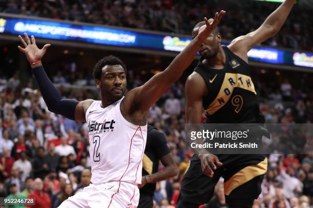 John Wall of the Washington Wizards reacts against the Toronto Raptors in the second half during Game Six of Round One of the 2018 NBA Playoffs at...