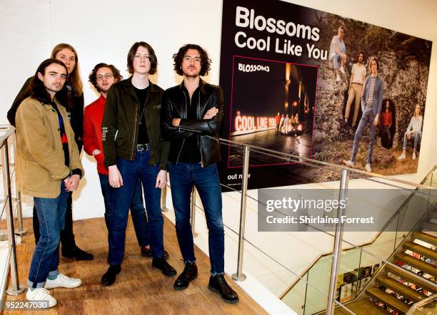 Josh Dewhurst, Myles Kellock, Joe Donovan, Tom Ogden and Charlie Salt of Blossoms pose with their giant instore poster following an instore signing...