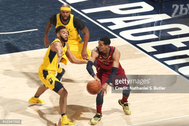 Jordan Clarkson of the Cleveland Cavaliers handles the ball against Cory Joseph of the Indiana Pacers in Game Six of Round One of the 2018 NBA...