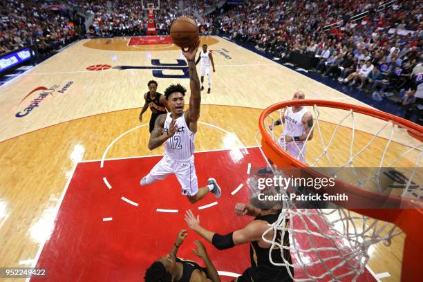 Kelly Oubre Jr. #12 of the Washington Wizards shoots against the Toronto Raptors in the first half during Game Six of Round One of the 2018 NBA...