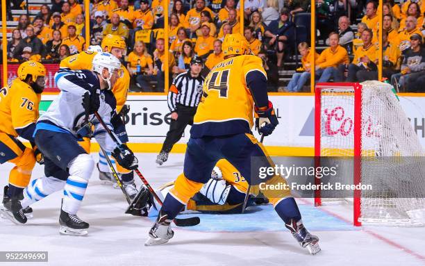 Paul Stastny of the Winnipeg Jets scores a goal against Mattias Ekholm of the Nashville Predators during the second period in Game One of the Western...