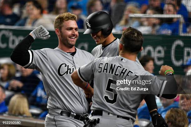 Matt Davidson of the Chicago White Sox celebrates his home run with Yolmer Sanchez of the Chicago White Sox in the fourth inning against the Kansas...