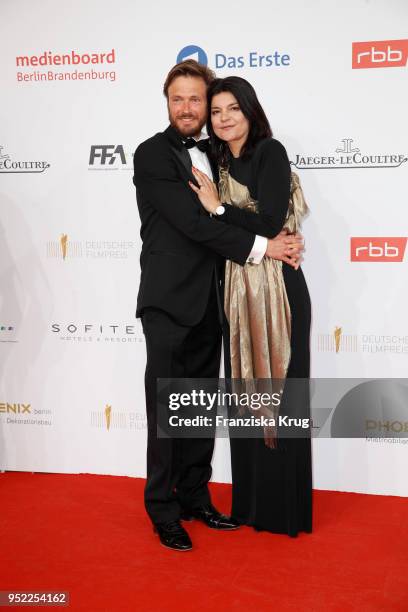 Andreas Pietschmann and Jasmin Tabatabai attend the Lola - German Film Award red carpet at Messe Berlin on April 27, 2018 in Berlin, Germany.