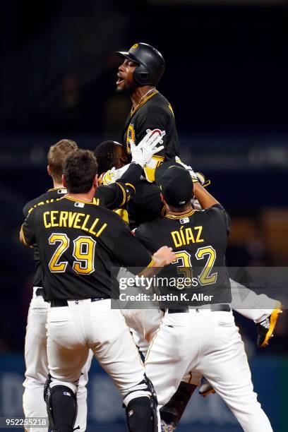 Starling Marte of the Pittsburgh Pirates celebrates after hitting a walk off single in the eleventh inning against the St. Louis Cardinals at PNC...