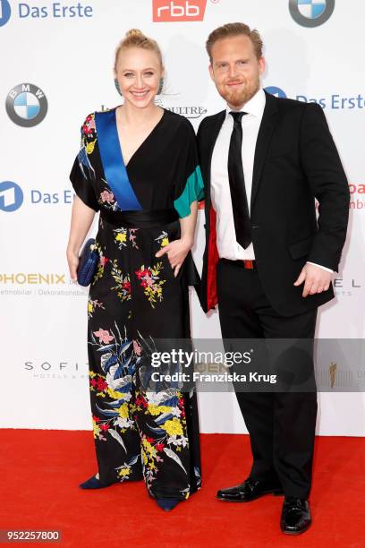 Anna Maria Muehe and Axel Stein attend the Lola - German Film Award red carpet at Messe Berlin on April 27, 2018 in Berlin, Germany.