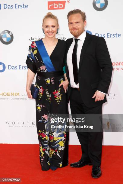 Anna Maria Muehe and Axel Stein attend the Lola - German Film Award red carpet at Messe Berlin on April 27, 2018 in Berlin, Germany.