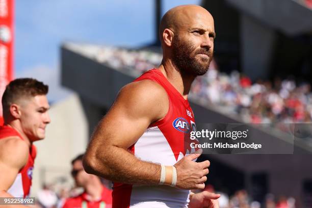 Jarrad McVeigh of the Swans leads the team out during the round six AFL match between the Geelong Cats and Sydney Swans at GMHBA Stadium on April 28,...