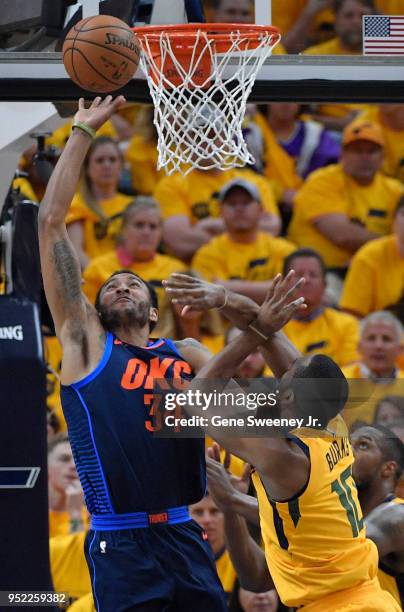 Josh Huestis of the Oklahoma City Thunder tries for the rebound off a shot by Alec Burks of the Utah Jazz in the first half during Game Six of Round...